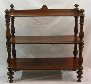 A Victorian mahogany 3 tier buffet with three-quarter gallery raised on bulbous turned columns 42"