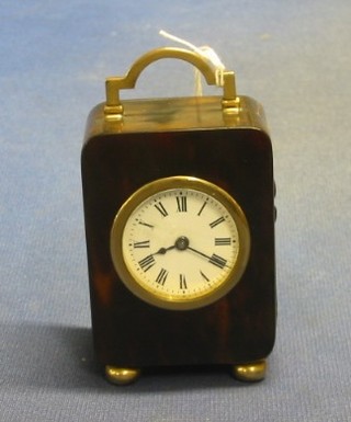 An Edwardian travelling timepiece contained in a tortoiseshell case (f and r) with 9ct gold mounts, 3"