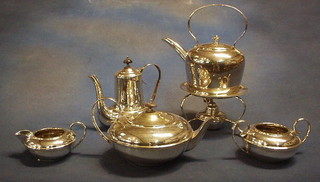 A 5 piece silver plated tea/coffee service comprising tea kettle, tea pot, twin handled sugar bowl, cream jug and coffee pot