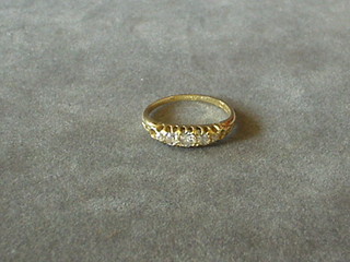 A lady's 18ct gold dress ring set 5 diamonds