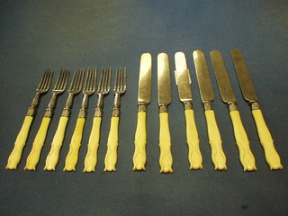 A set of 6 Victorian fruit knives and forks with carved ivory handles