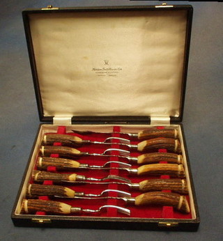 A set of 6 steak knives with stag horn handles, cased