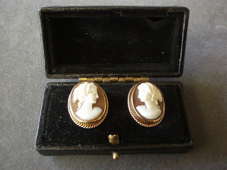 A pair of Victorian 9ct gold ear studs set shell carved cameo portraits of classical ladies