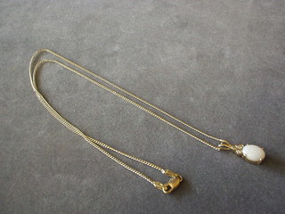 A lady's 18ct gold chain hung a pendant set 3 diamonds and an opal