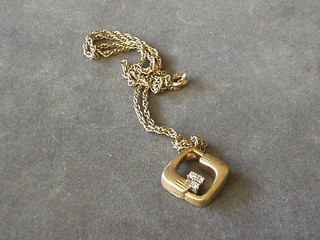 A fine gold chain hung a 9ct gold pendant set 3 diamonds 