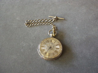 A lady's open faced fob watch contained in a Continental silver case hung on a silver curb link chain