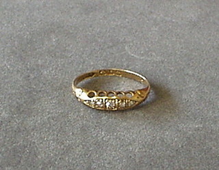 A lady's 18ct gold dress ring set 5 diamonds