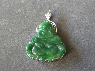 A jade coloured pendant of a seated Buddah