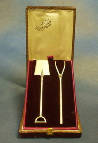 A French silver gilt presentation butter spade and an asparagus fork in the form of a spade and pitch fork, cased