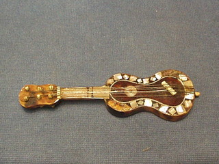 A miniature tortoiseshell guitar 5"