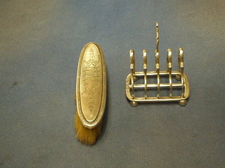 An Edwardian silver 5 bar toast rack, London 1909 and a silver backed clothes brush