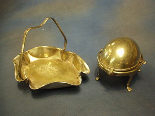 A silver plated oval roll top butter dish and a cake basket