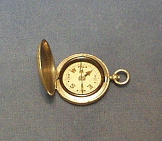 A Prasmatic compass contained in a polished steel case