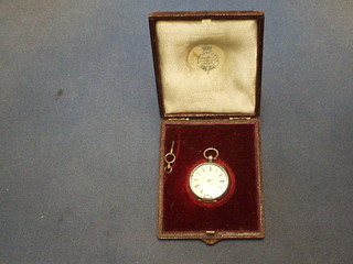 A lady's open faced fob watch contained in a chased silver case (f)