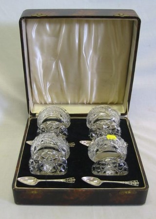 A set of 4 cut glass sundae dishes and 4 silver grapefruit spoons with Jubilee mark 1935 contained in a fitted case