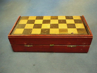 A red and white turned ivory chess set, contained in a mahogany chess board 