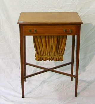 A 19th Century rectangular satinwood work box fitted a drawer and basket, raised on square tapering supports united by an X framed stretcher 20"