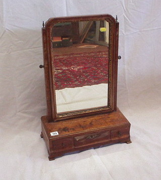 A 19th Century shaped plate dressing table mirror contained in a mahogany frame, the base fitted 1 long and 2 short drawers, on ogee bracket feet 15"