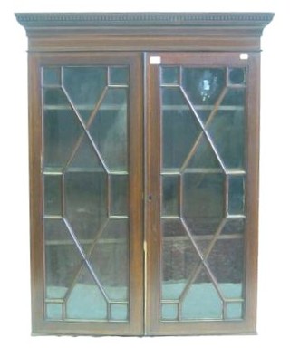 A 19th Century inlaid mahogany hanging cabinet with moulded and dentil cornice, fitted adjustable shelves enclosed by astragal glazed panelled doors 35"