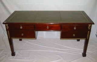 A 20th Century Continental mahogany desk with inset tooled leather writing surface above 2 short and 4 long drawers, raised on square tapering supports ending in spade feet, 62"