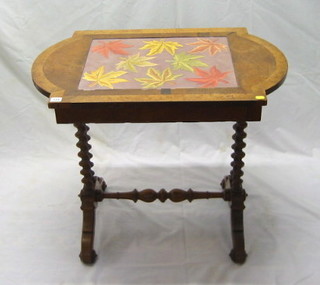 A Victorian walnutwood stretcher table with spiral turned columns and later crossbanded top 33"