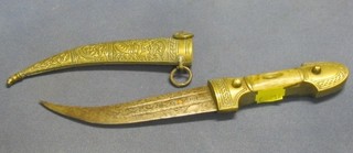 An Eastern dagger contained in a brass scabbard 11"
