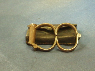 A pair of 19th Century iron handcuffs with leather carrying case