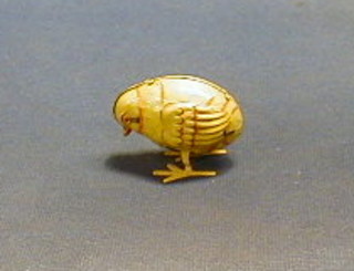 A German Occupied Zone tin plate clock work figure of a chick