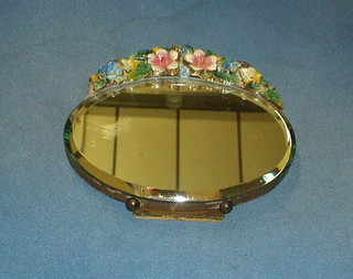 A 1920's table mirror with barbola mounts