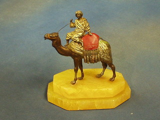 A  painted spelter table lighter (f) in the form of a camel with Bedouin, on a marble base 5"