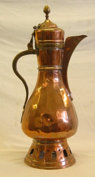A large Turkish copper coffee pot 25"