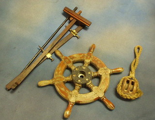 A small wooden ships wheel 16", a pulley, 2 gauges 1 marked W Coates and a baton