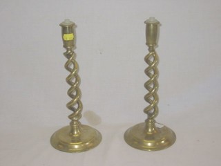 A pair of brass spiral turned candlesticks converted for use as table lamps 12"