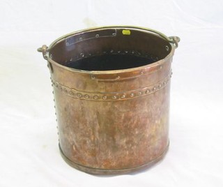 A 19th Century copper log bin with brass swing handle