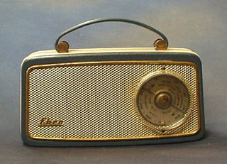An Ekco portable radio contained in a blue fibre case