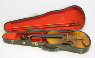 A Chinese violin with bow and carrying case