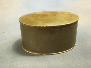 An oval planished pewter biscuit box with hinged lid 8"