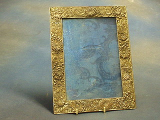 An Oriental antimony easel photograph frame decorated chrysanthemums 11" x 8"