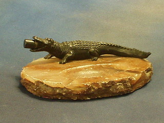 An Art Deco pink veined marble and metal table lighter/ashtray in the form of a crocodile 9"