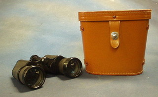 A pair of Majestic 10 x 50 binoculars in leather carrying case