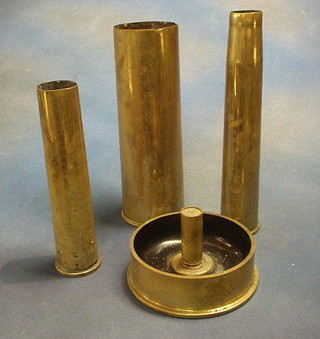 A 25lbs shell case, 2 brass trench art ashtrays and 4 other shell cases