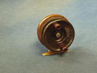 A Millbrook Alpha Bakelite and wooden centre pin fishing reel