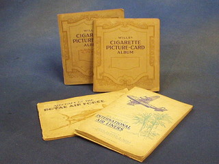 An albums of Wills cigarette cards "Railway Engines" Players "Hints on Association Football", Players "Coronation State Ceremonial Dress", Ardath Tobacco "Briton's Defence" and 3 Players cigarette card albums "Aircraft The Royal Air Force" x 2 and "International Airliners"