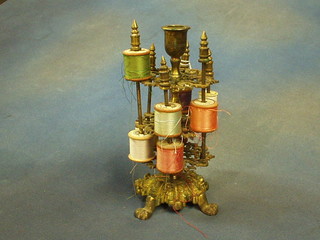 A Victorian gilt metal bobbin stand surmounted by a candle sconce 10"