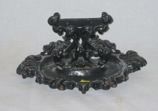 An iron boot scraper 14"