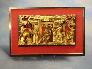 An Eastern pierced hardwood plaque depicting figures in a temple 11"
