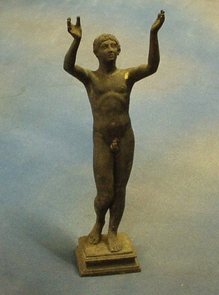 After the Antique a bronze figure of a standing naked man, raised on a square base 12"