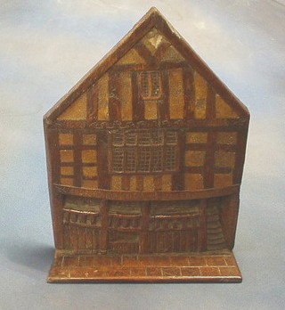 A 19th Century carved elm wall plaque in the form of a Tudor half timbered house 11"