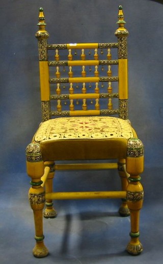 8 Moorish painted ladder back dining chairs, the seats embroidered with gold wire, on turned supports