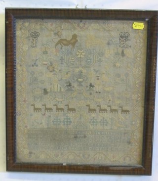 An 18th/19th Century wool work sampler, monogrammed FK with lion and unicorn, animals and alphabet, 13" x 11"